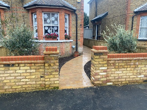 Surbiton Victorian front garden framed planting beds either side of the new path