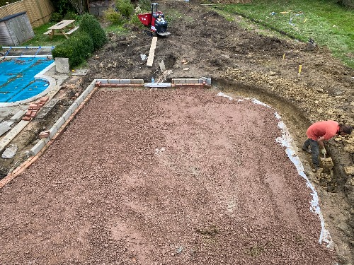 Excavation and clay soil removal in progress in a Cobham garden