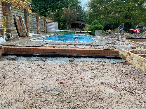 Submersible dirty water pump installation at a low point in the garden