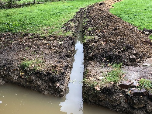 Large Cobham garden affected by drainage issues on London Clay before works begin