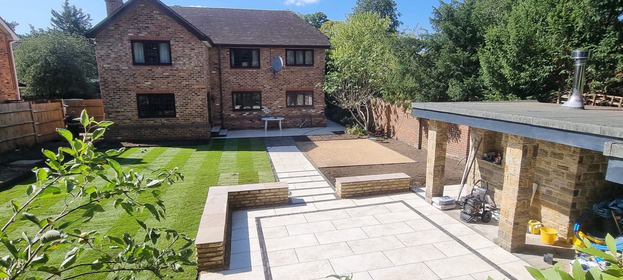 Porcelain patio with timber pergola, Surrey, by Flourish Landscaping