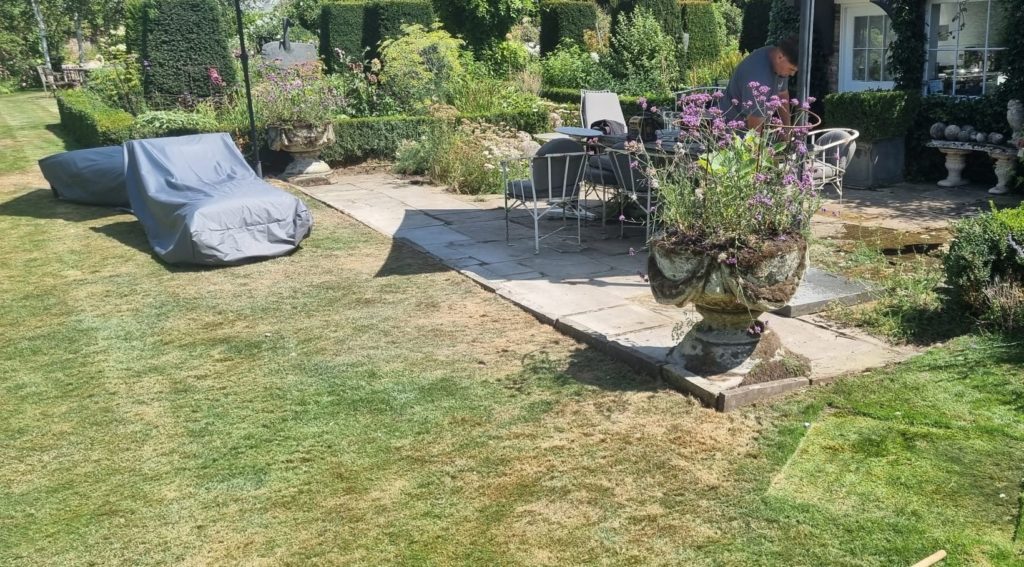 Original Yorkstone terrace being repaired in a period garden in Ham looked after by Flourish Landscaping, with box hedging, Lavandula and Verbena bonariensis